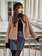 a lady wears an eco-friendly fur coat with black leather mini skirt